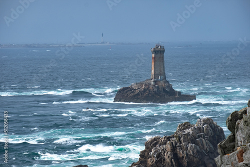La Vieille lighthouse on a lonely rock in the water at Pointe du Raz, Finistere, Brittany photo