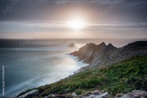 Sunset long exposure at Pointe du Raz promontory, Finistere, Brittany photo