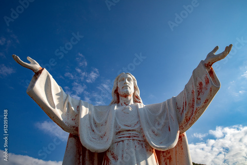 Statue of Jesus Christ with open arms in Delaj, Montenegro photo
