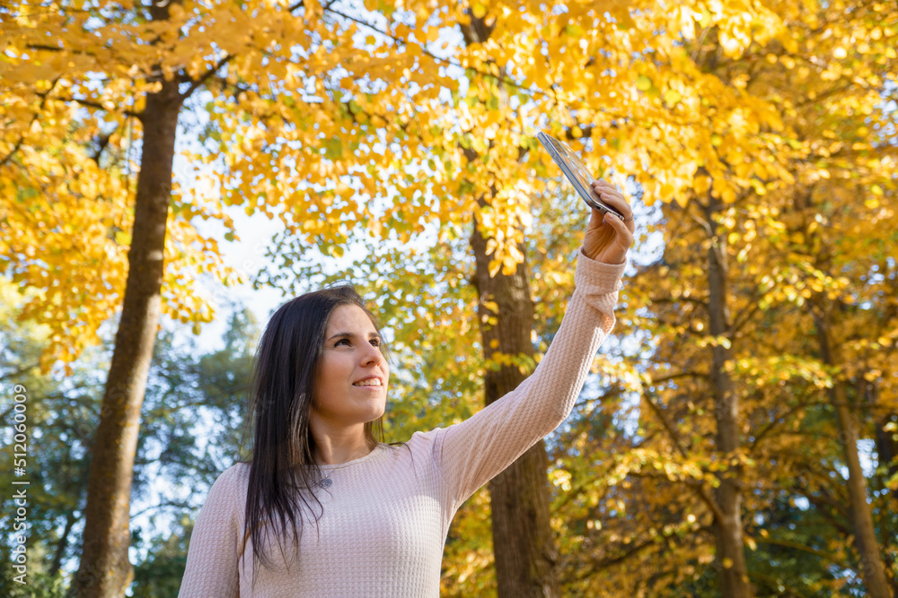 woman young woman taking a selfie in autumn woman young woman taking a selfie in autumn