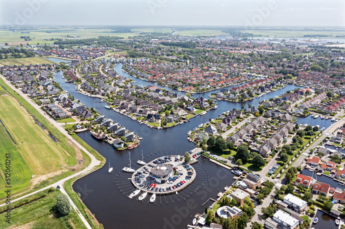 Aerial top shot from houses with boats in Friesland the Netherlands
