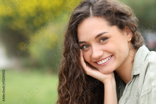 Beautiful woman looking at you with perfect smile