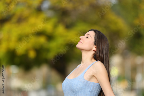 Relaxed teen breathing fresh air in a park