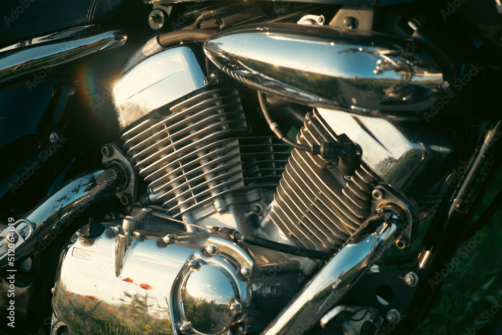 Close up photo of and old school motorcycle engine Close up photo of and old school motorcycle engine