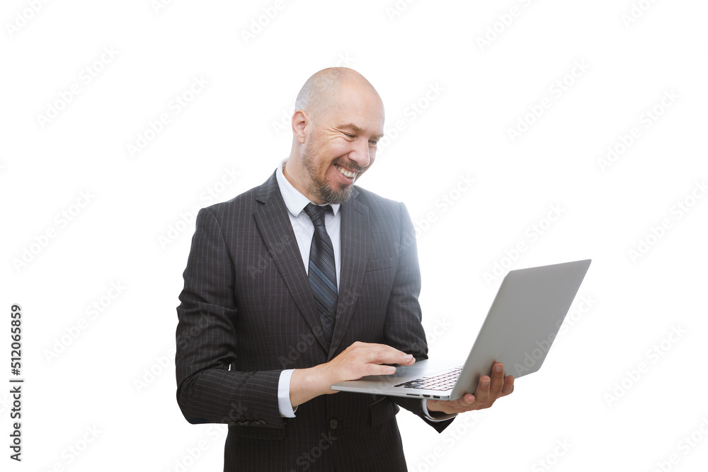 Bald man in suit looking very attentively at a laptop in his hands isolated on white background. Bald man in suit looking very attentively at a laptop in his hands isolated on white background.