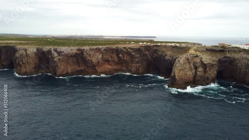 View of the lighthouse and cliffs at Cape St. Vincent at sunset. Continental Europe's most South-western point, Sagres, Algarve, Portugal.
