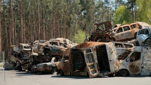 City dump of destroyed cars of civilians in Irpin, Ukraine. War in Ukraine.