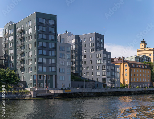 New and old apartment buildings at the water front in the district Nacka a sunny summer day in Stockholm 