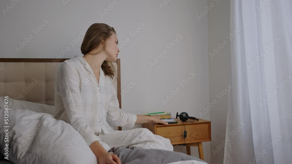Depressed woman suffers from headache after waking up Depressed woman suffers from headache after waking up