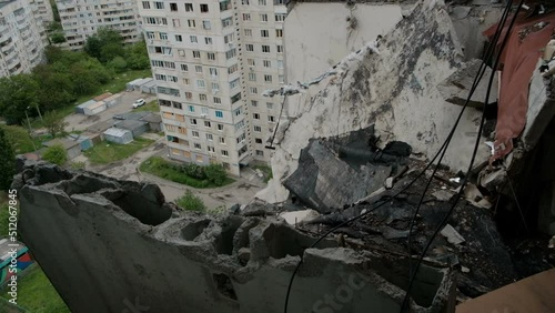 Survived carpet on the wall. View of destroyed residential building. Kharkiv, Ukraine.