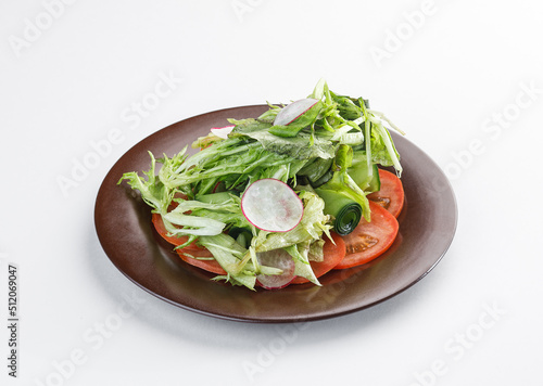 salad on a plate isolated on white