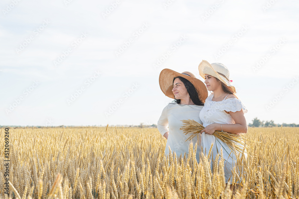 Two smiling female friends in the wheat field Two smiling female friends in the wheat field