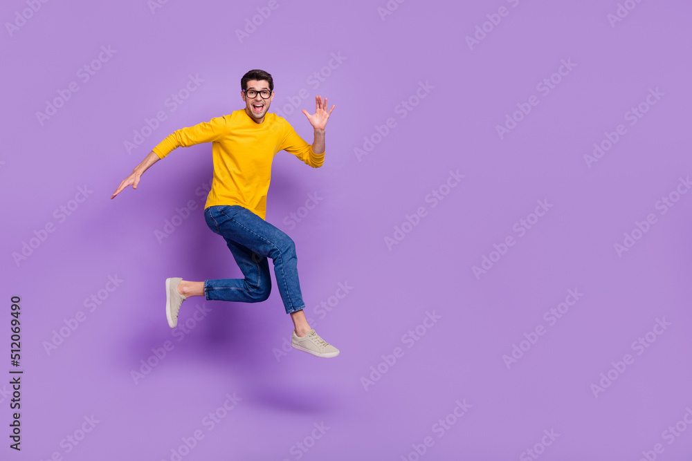 Full size profile side photo of cheerful carefree man running traveling during summer holiday isolated on purple color background