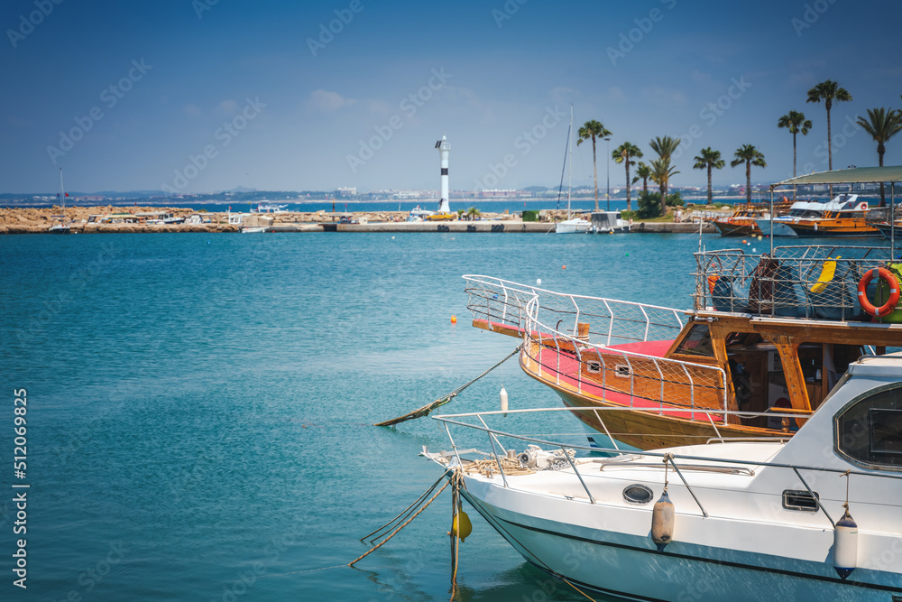 Port with sightseeing boats, beautiful scenery, Side resort town in Turkiye Port with sightseeing boats, beautiful scenery, Side resort town in Turkiye