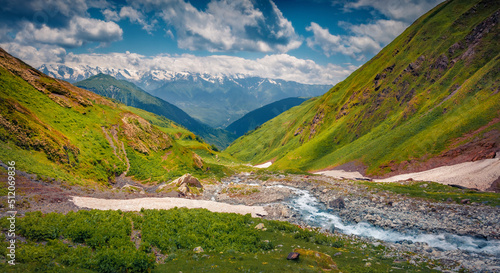 Blue creek flowing in Caucasus mountains. Attractive summer scene of Upper Svaneti  Georgia  Europe. Beauty of nature concept background.