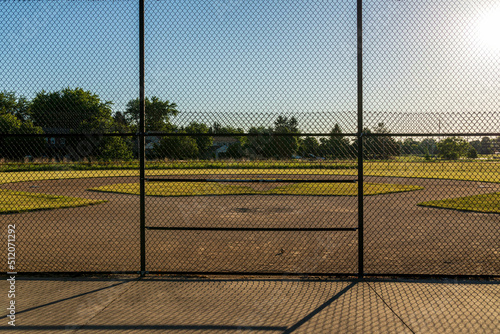 the infield of a baseball diamond in the early morning