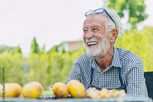happy elderly man healthy senior confident smile at park outdoors with beautiful white teeth from denture prosthetics.