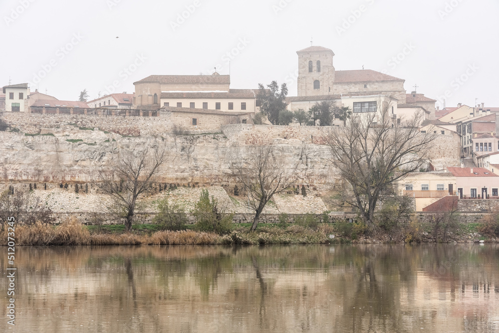 View of the city of Zamora with San Isidoro church and the Douro river in a foogy day.