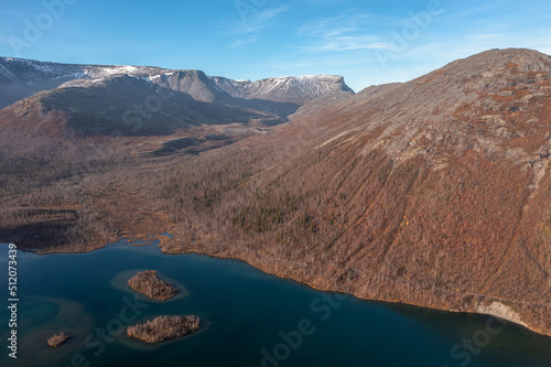 The beautiful blue lake is mountain peaks. Mountain landscape in Kola Peninsula, Arctic, tundra