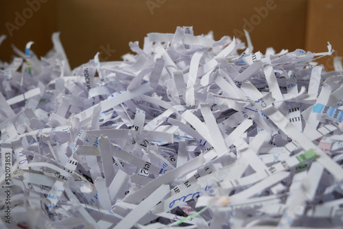 .Heap of white shredded papers background