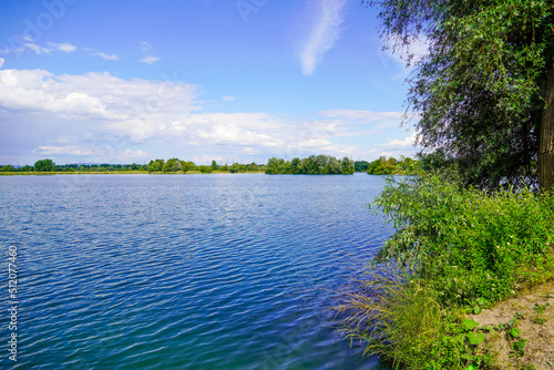 Ehrlichsee near Oberhausen-Rheinhausen. Lake with surrounding landscape in summer. 