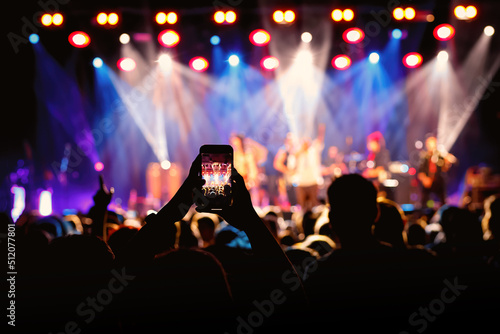 Fototapeta Video recording of the concert using a smartphone