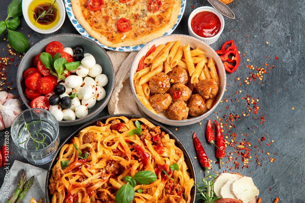 Italian food assortment on dark background. Italian food assortment on dark background.