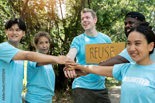 Volunteer putting their hands together unity symbol during, stacked huddle together, achieve their ultimate goal. 