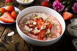 Homemade porridge with strawberry and almond