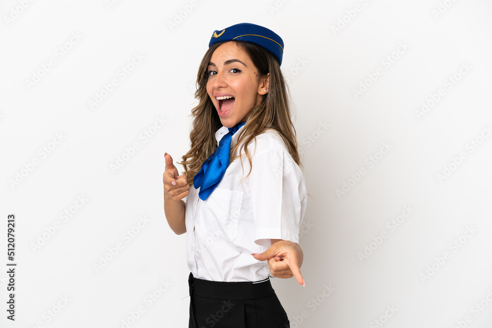 Airplane stewardess over isolated white background pointing to the front and smiling Airplane stewardess over isolated white background pointing to the front and smiling