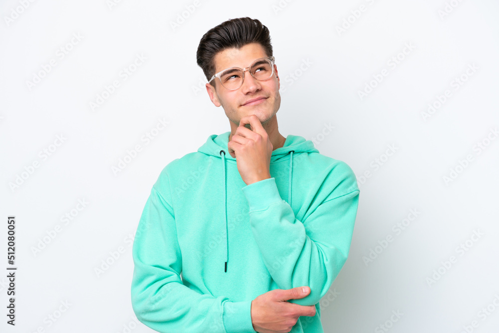 Young handsome caucasian man isolated on white bakcground thinking an idea while looking up Young handsome caucasian man isolated on white bakcground thinking an idea while looking up