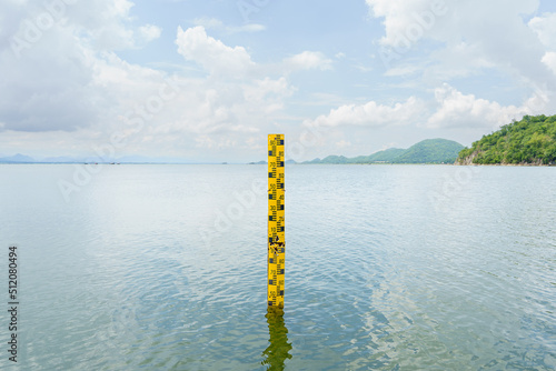 The yellow scale measures the height of the water in the dam. The water in the reservoir is plentiful and is used for agriculture and the village consumption.Reserving water nature in Thailand