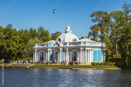 View of the Grotto pavilion on the banks of the Big Pond and crowds of tourists near the pavilion. Tsarskoe Selo, city of Pushkin, Russia