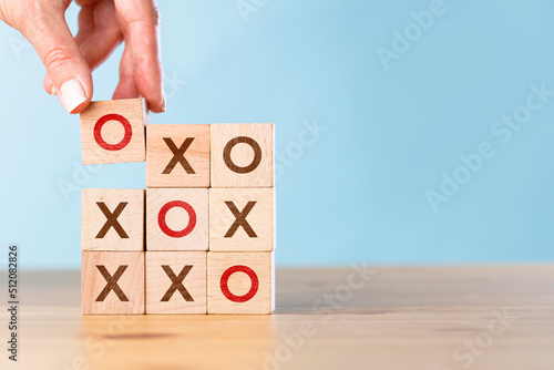 Photos Tic tac toe concept. Business woman wins the OX game