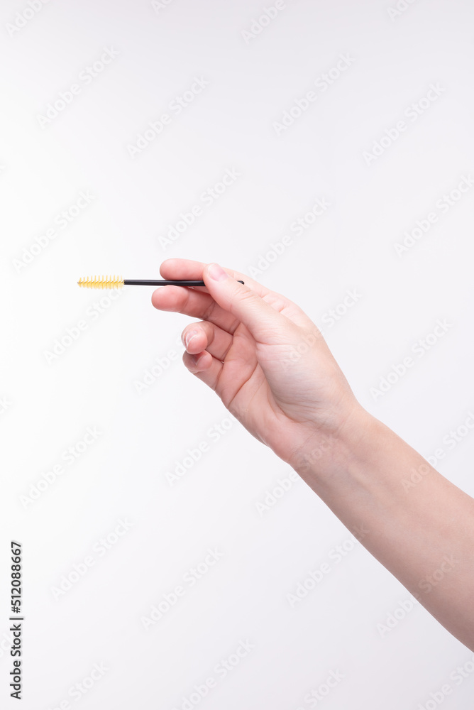 Eyebrow brush in hand Eyebrow brush in hand