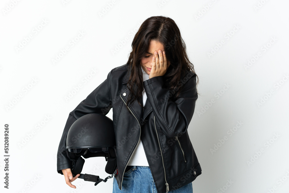 Woman holding a motorcycle helmet isolated on white background with tired and sick expression Woman holding a motorcycle helmet isolated on white background with tired and sick expression