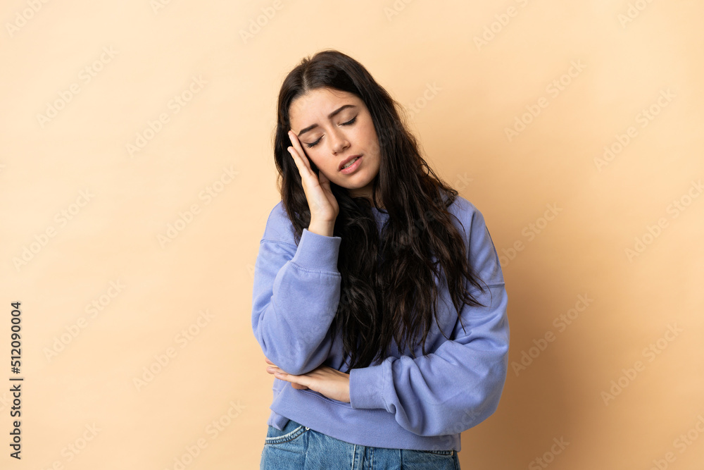 Young caucasian woman over isolated background with headache Young caucasian woman over isolated background with headache