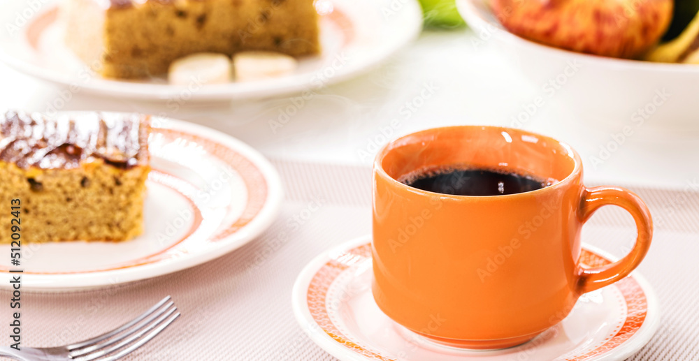 cup of coffee with cake in the background, typical hot drink from Brazil, served in bakeries and snack bars cup of coffee with cake in the background, typical hot drink from Brazil, served in bakeries and snack bars