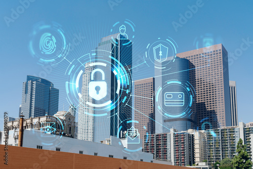 Panorama cityscape of Los Angeles downtown at day time  California  USA. Skyscrapers of LA city. Glowing Padlock hologram. The concept of cyber security to protect companies confidential information