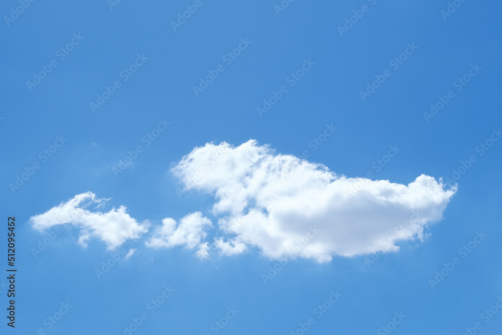 Fototapeta premium Single white cloud on blue sky background