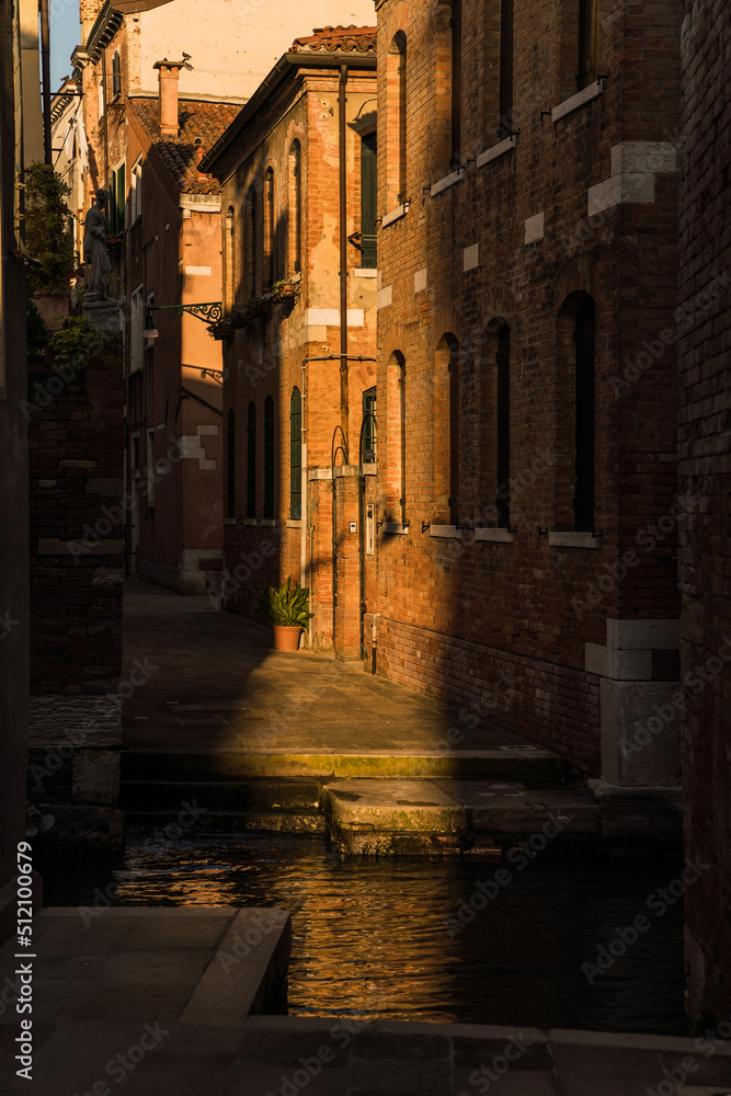 Old alley street and high contrast lighting in Venice, Italy 