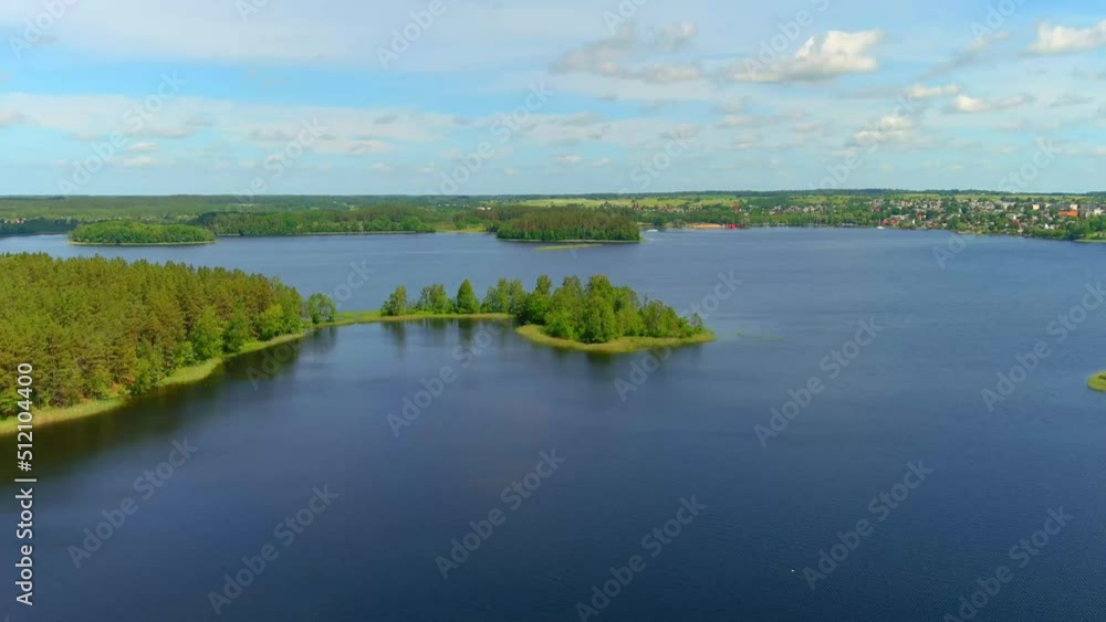 aerial drone view of lake in Zarasai, Lithuania. Holiday in Lithuania concept. Zarasai lake with deep blue water color and clear sky HD Video. aerial drone view of lake in Zarasai, Lithuania. Holiday in Lithuania concept. Zarasai lake with deep blue water color and clear sky HD Video.