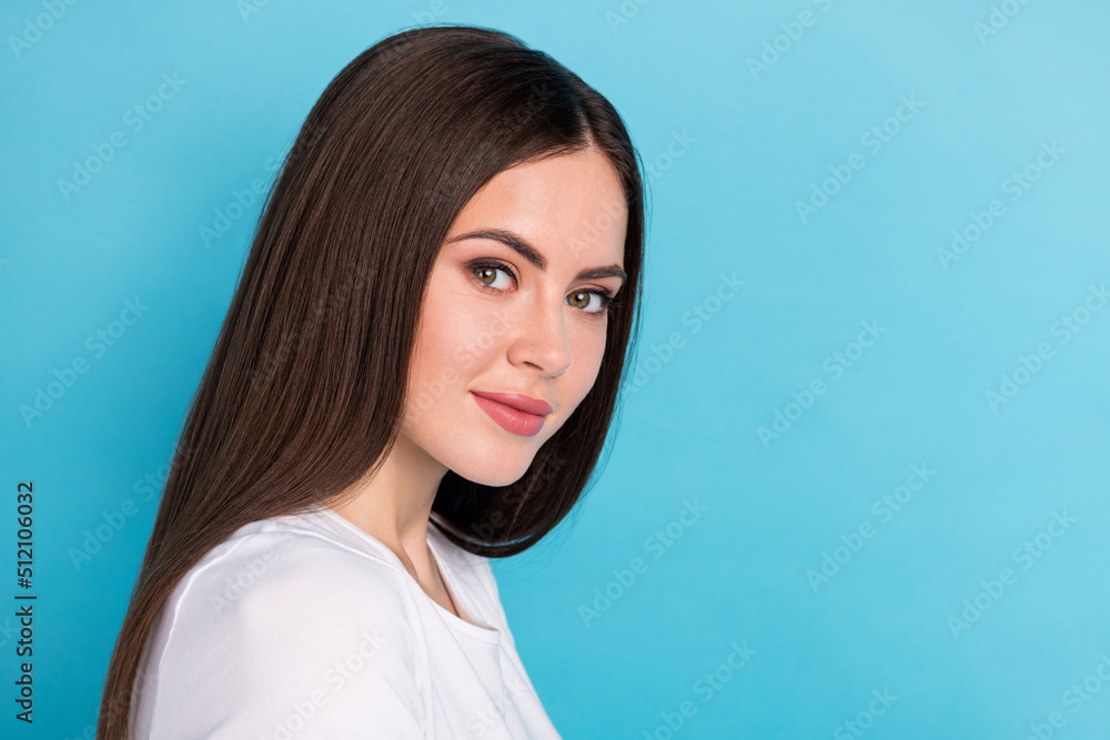 Portrait close-up photo of cute adorable positive girl with long silky straight hair isolated on blue color background Portrait close-up photo of cute adorable positive girl with long silky straight hair isolated on blue color background