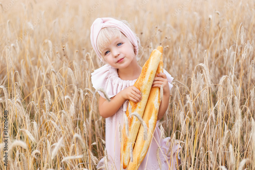 Happy three years old girl smiling and laughing in summer day at nature. Portrait of handsome blond girl with blue eyes, face close up at summer time, in the wheat field. Happy three years old girl smiling and laughing in summer day at nature. Portrait of handsome blond girl with blue eyes, face close up at summer time, in the wheat field.