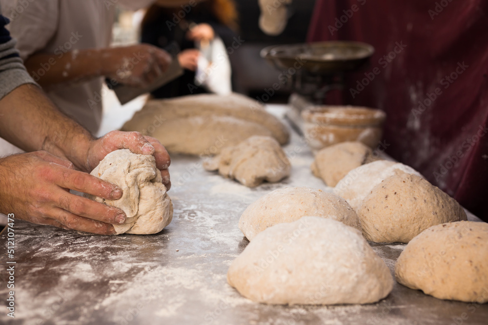 male hands knead yeast dough for baking bread male hands knead yeast dough for baking bread