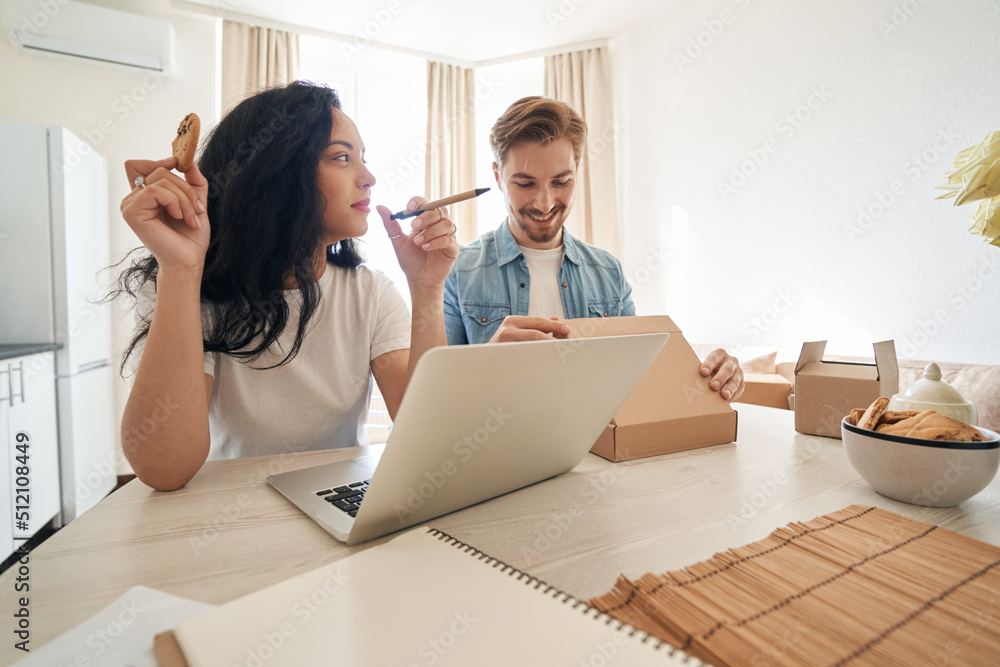 Online store employees preparing ordered goods for shipping Online store employees preparing ordered goods for shipping
