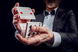 Croupier or casino dealer at gambling club or casino. Close up of male hand. Gambling concept