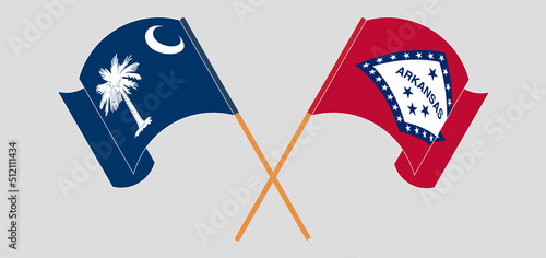 Crossed and waving flags of The State of South Carolina and The State of Arkansas