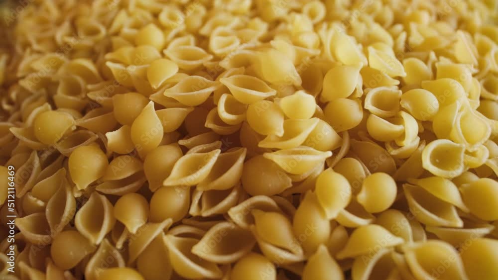 gluten free cornmeal pasta falling into a pile gluten free cornmeal pasta falling into a pile