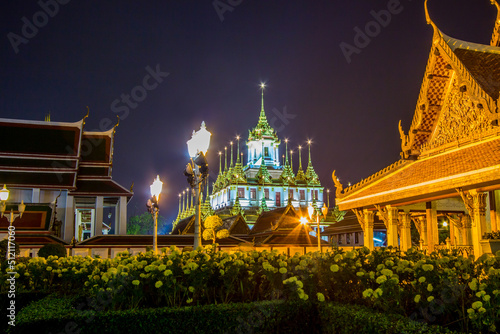 Night scene of Loha Prasat at Wat Ratchanaddaram Woravihara-buddhist temple located in Phra Nakhon district Bangkok Thailand. Also called the  Metal Castle .